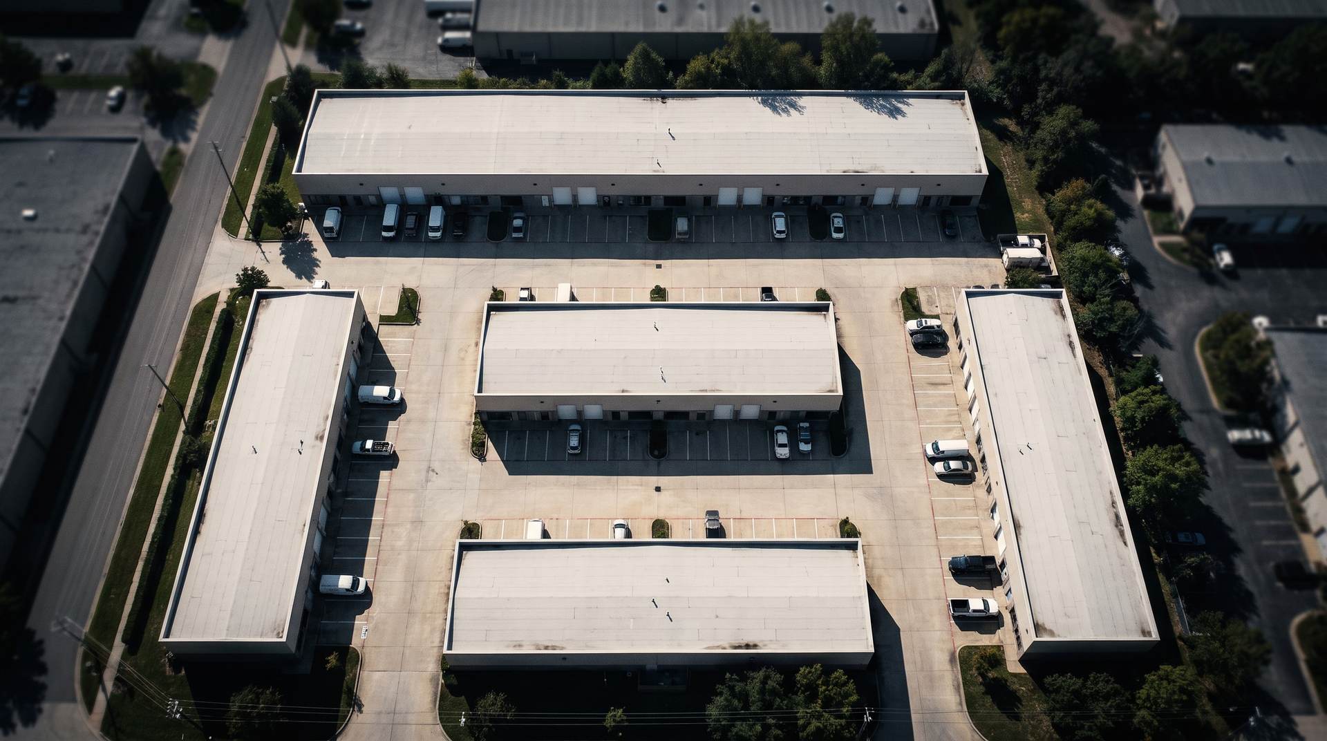 Aerial view of a flex-industrial park with several buildings around shared drive aisles